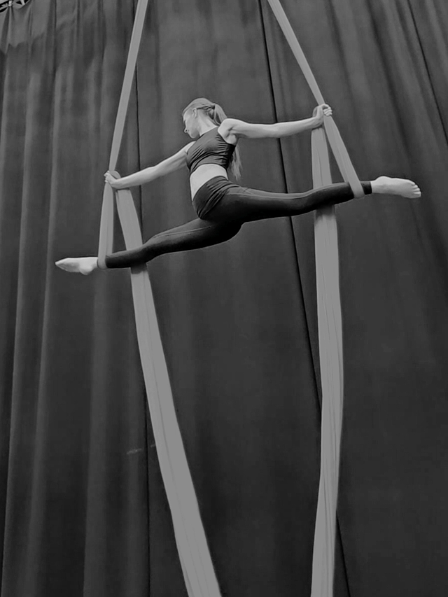 Lauramaria mid-pose on aerial silks
