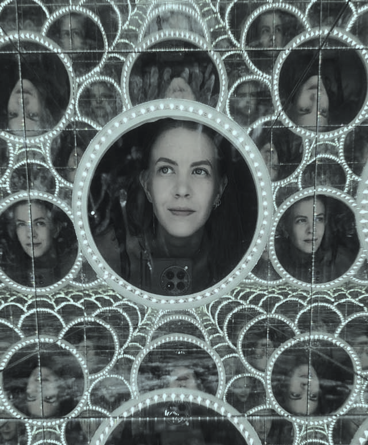 Portrait of Lauramaria reflected in a circular photobooth mirror collage